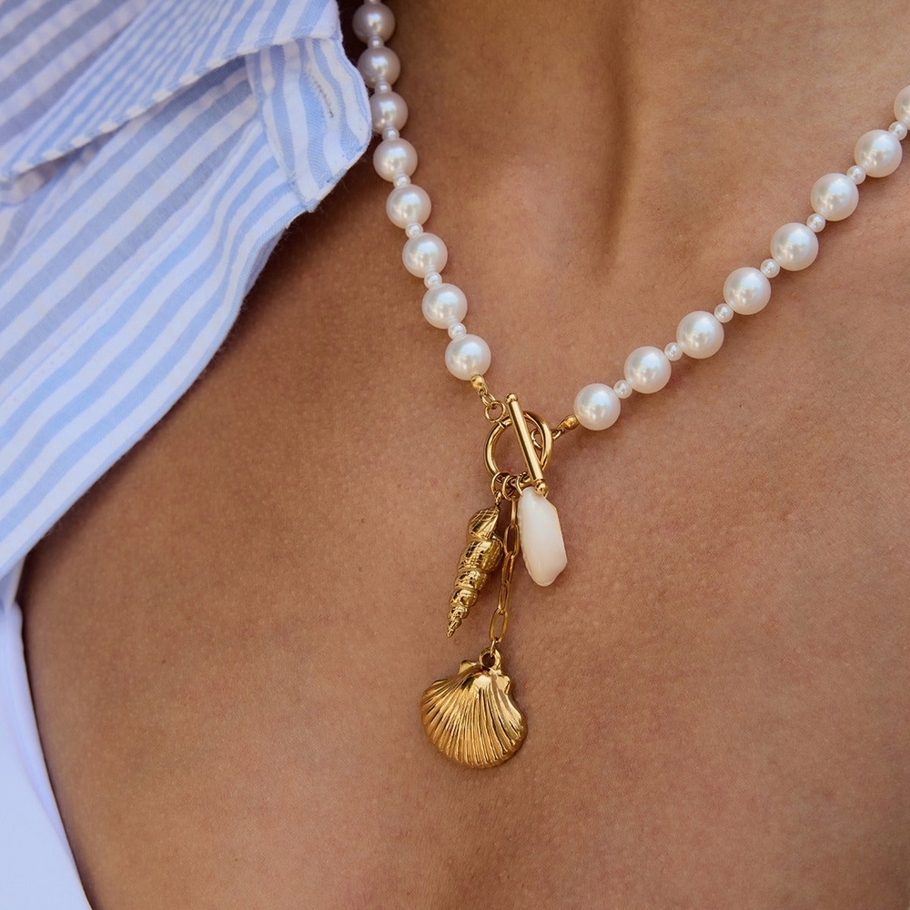 Elegant Pearl and Gold Charm Necklace